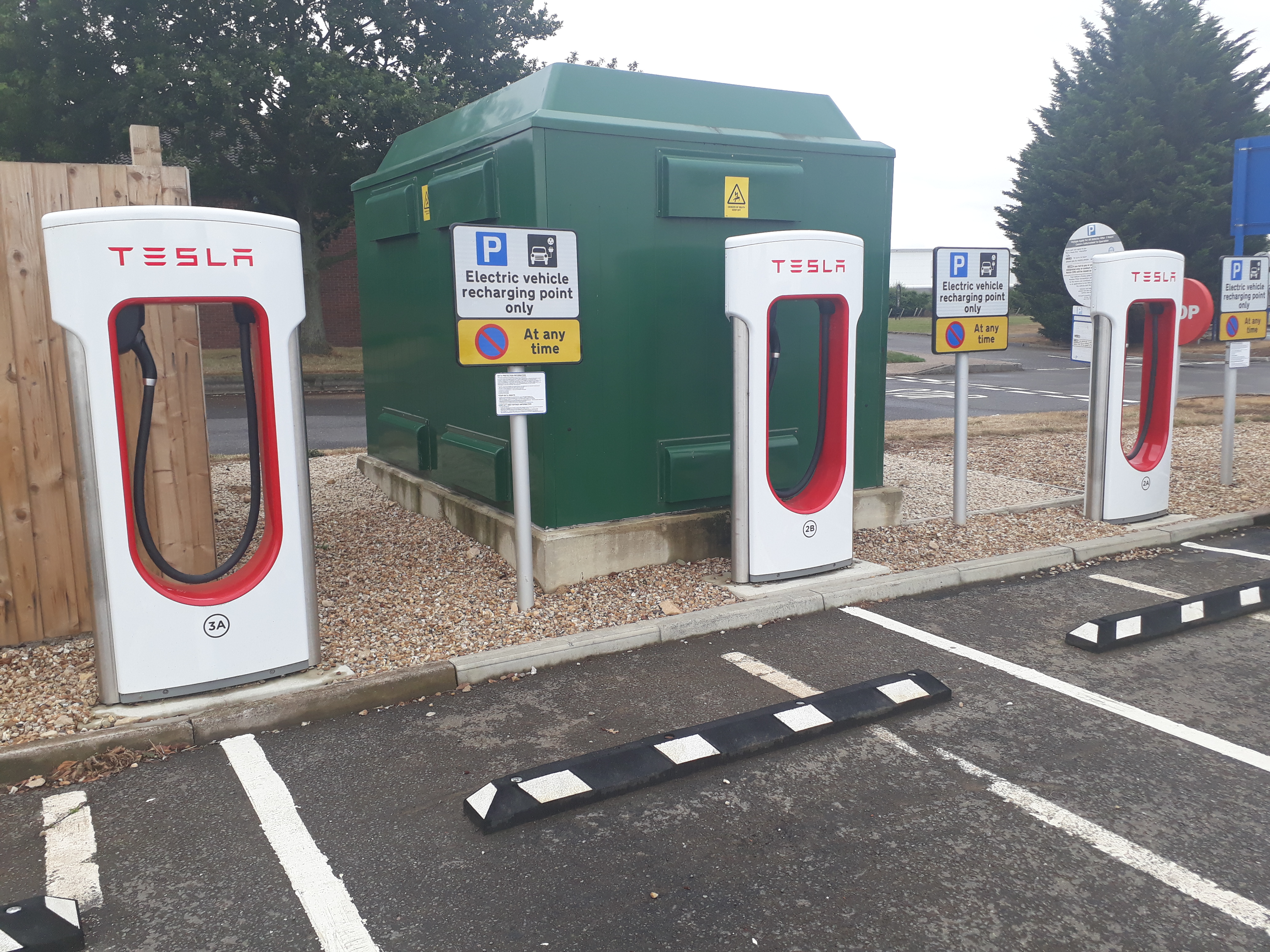 Electric vehicle plugged into a charging station